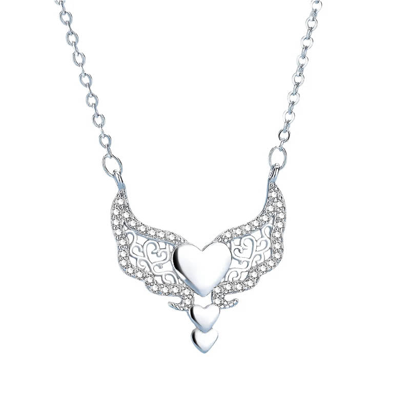 Elegant silver necklace with winged heart design.