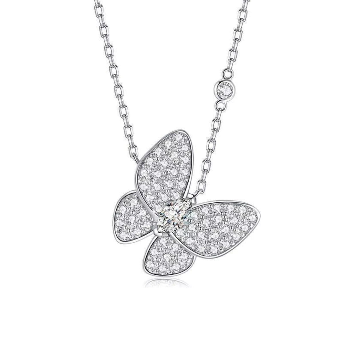 Close-up of butterfly pendant on silver chain