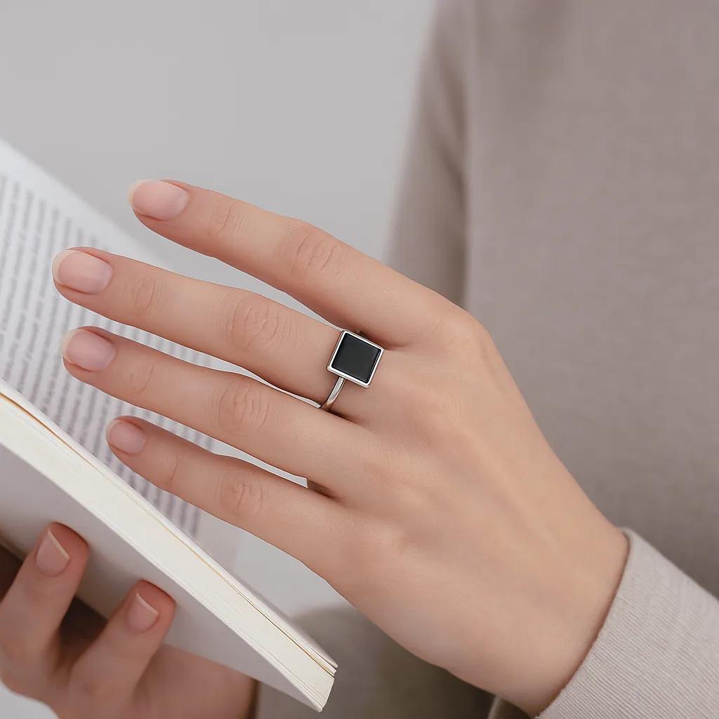 S925 stamped black stone geometric ring in flat lay