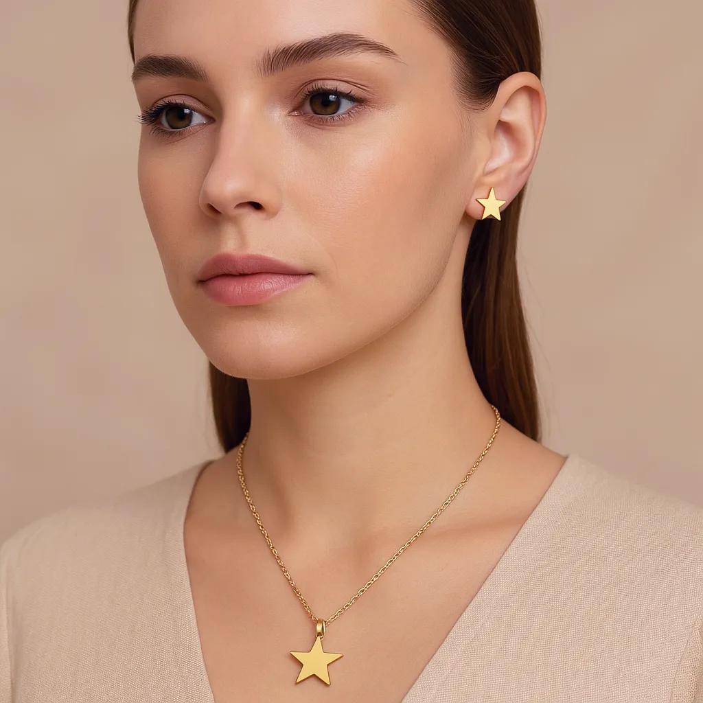 Model wearing gold minimalist star necklace and earrings