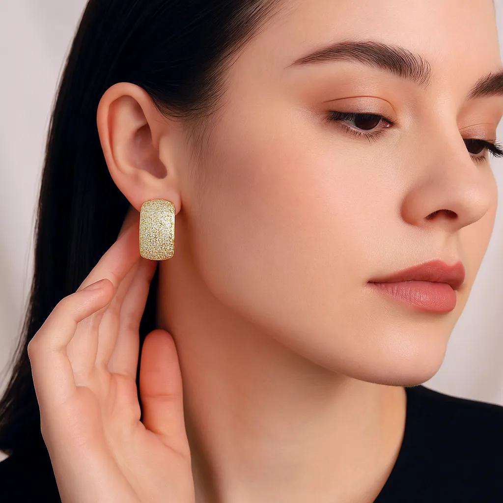 Gold-tone U-shaped earrings with brilliant CZ stones