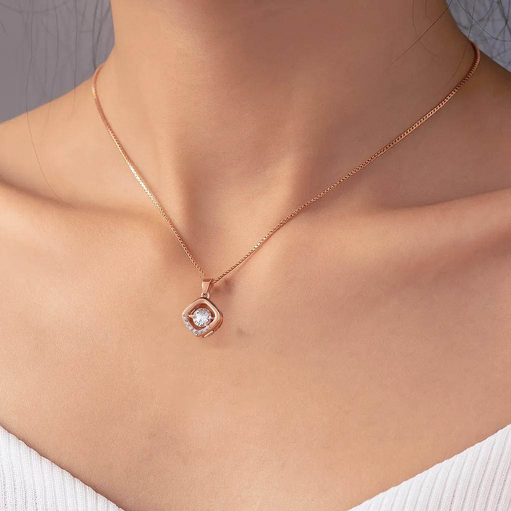 Delicate open square design in rose gold finish.