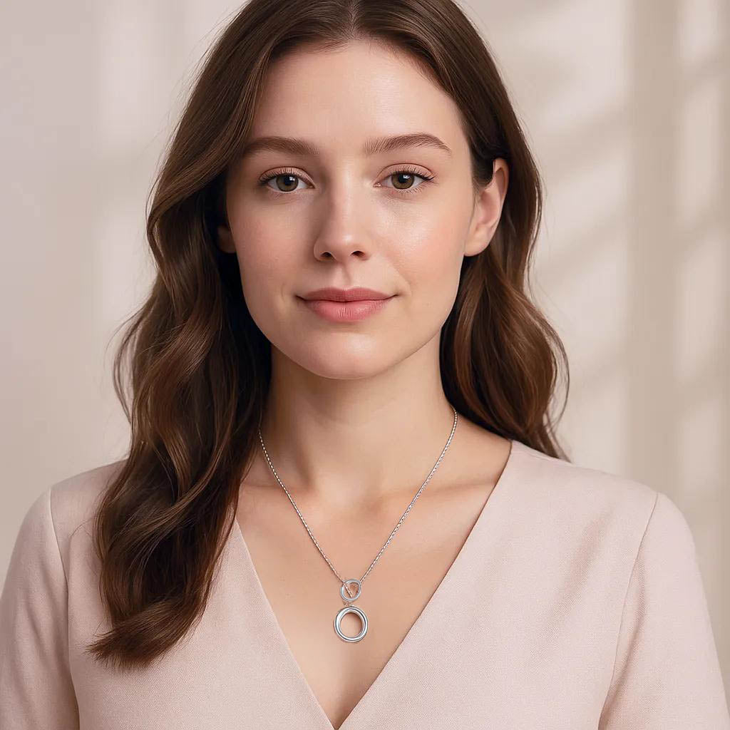 Close-up of minimalist circle necklace design.