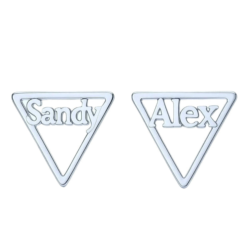 Close-up of silver personalized triangle earrings.  