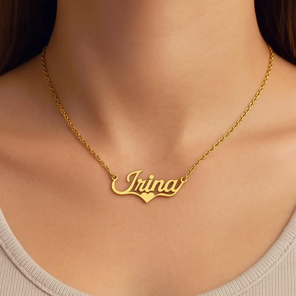 Close-up of gold script name necklace