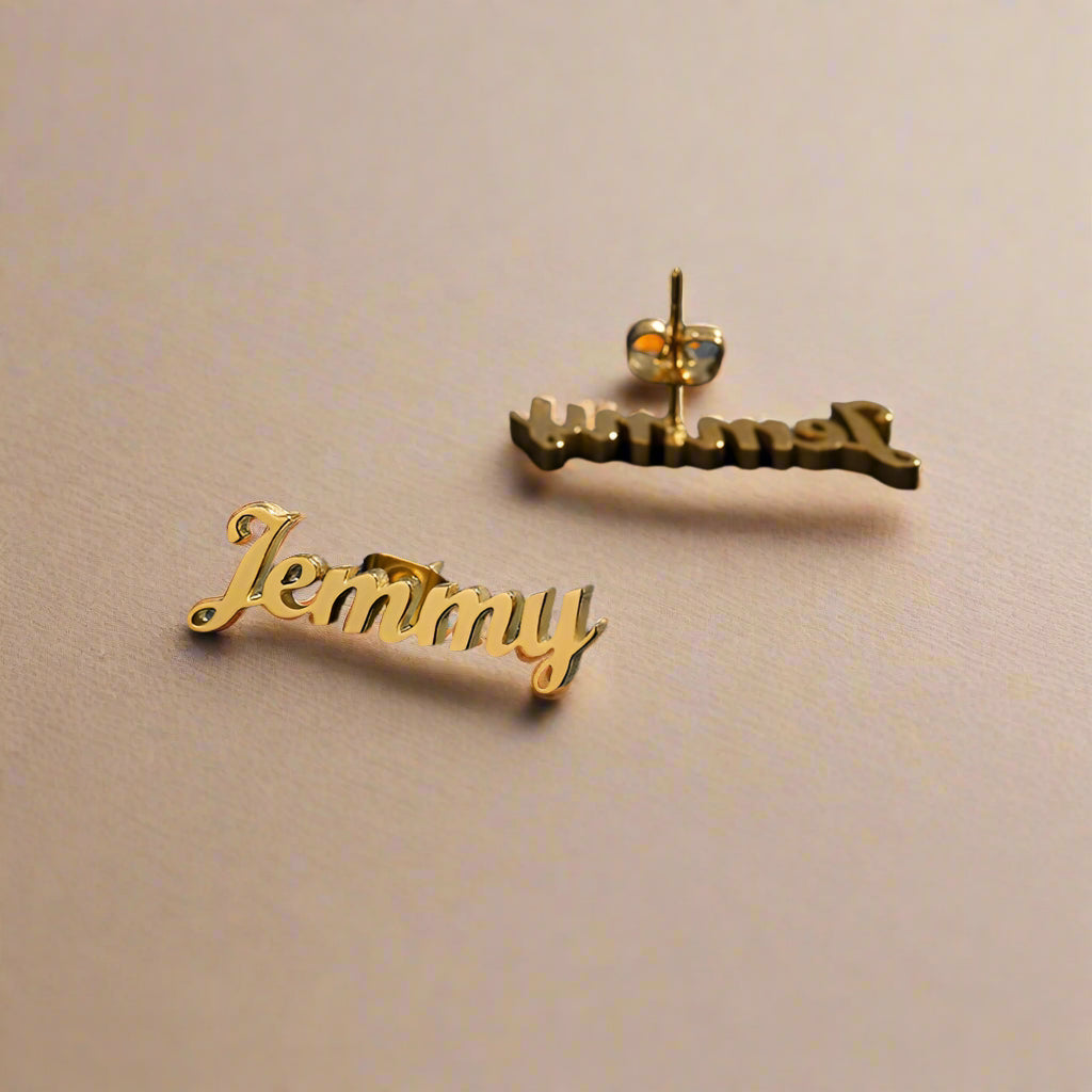 Close-up of personalized gold earrings