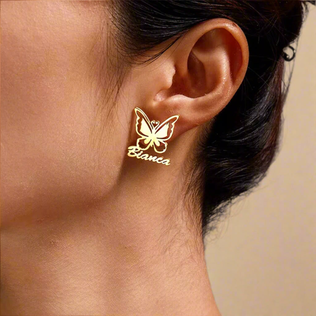 Close-up of gold-plated butterfly earrings