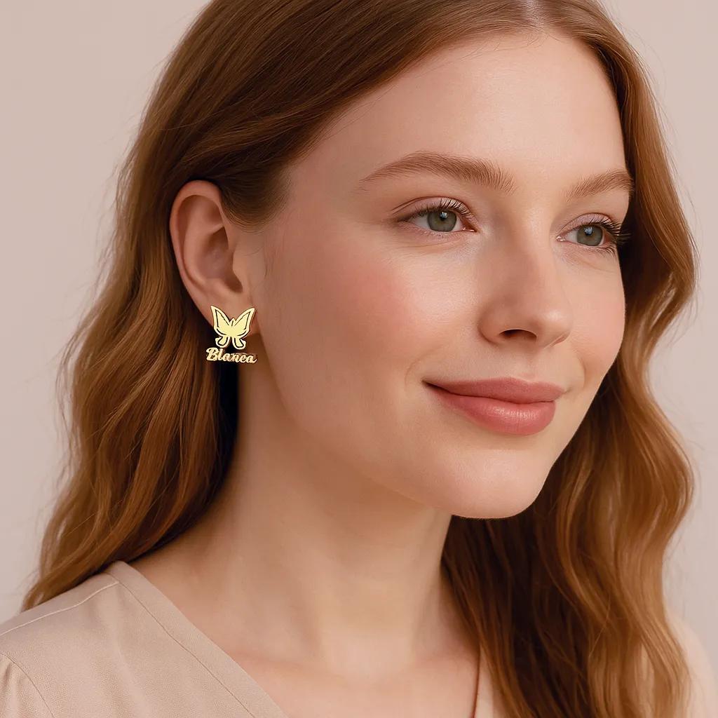 Close-up of gold-plated butterfly earrings