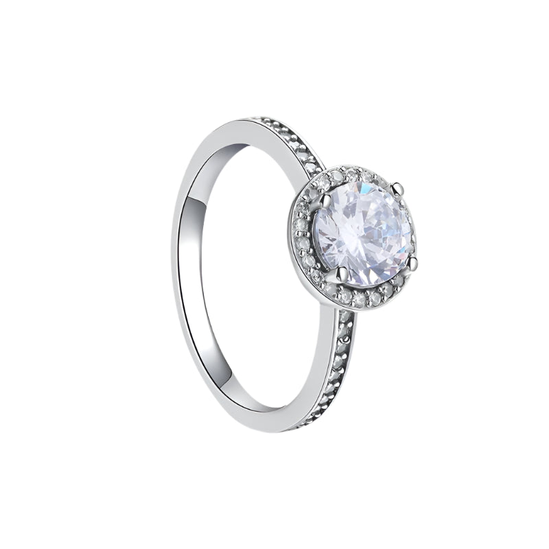 Silver ring with a clear gemstone on a white background, featuring a 'Sterling Silver 925' stamp.