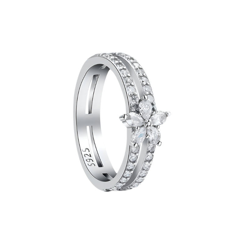 Silver ring with floral design and 'Sterling 925' stamp on a white background
