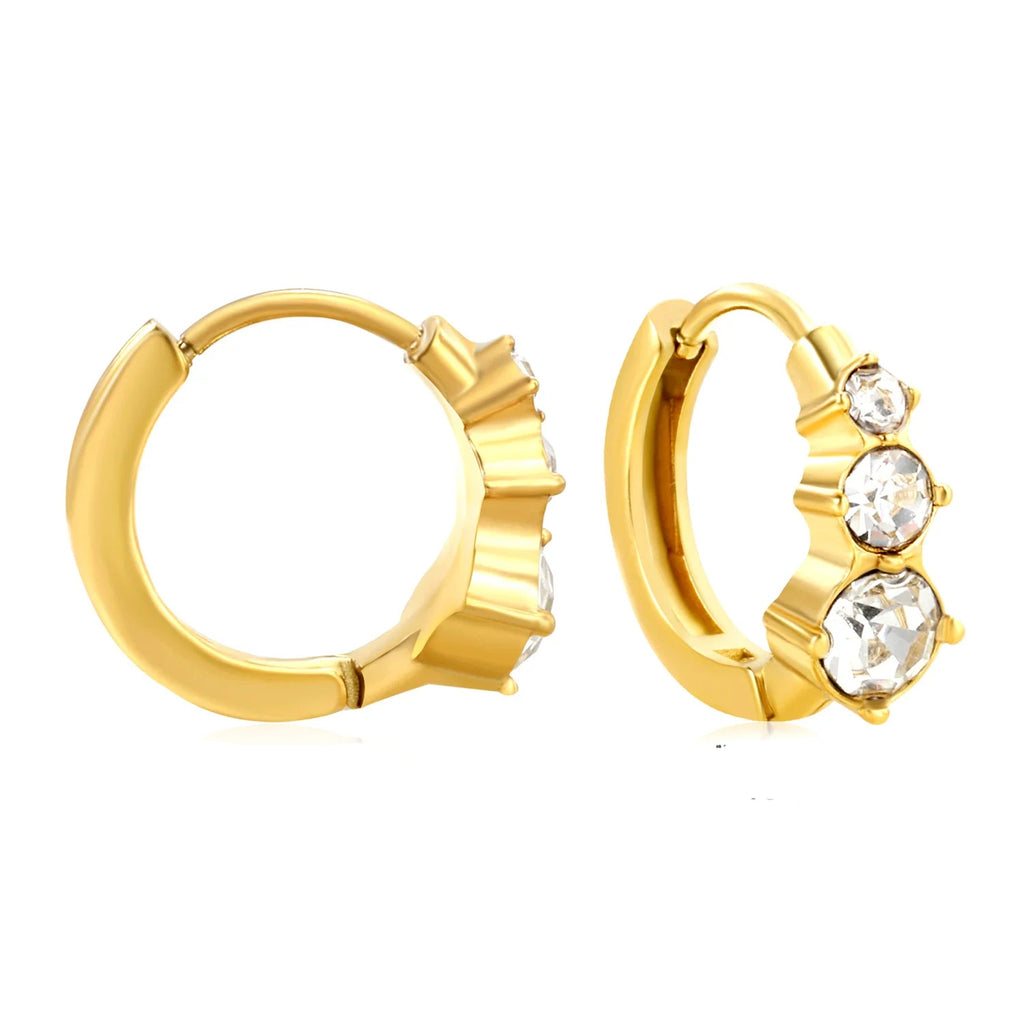 Gold hoop earrings with clear gemstones on a white background