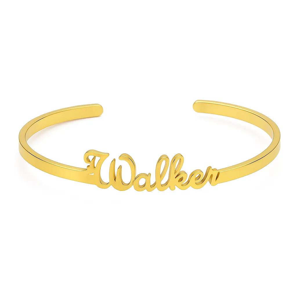 Gold bracelet with 'Walker' engraving on a white background