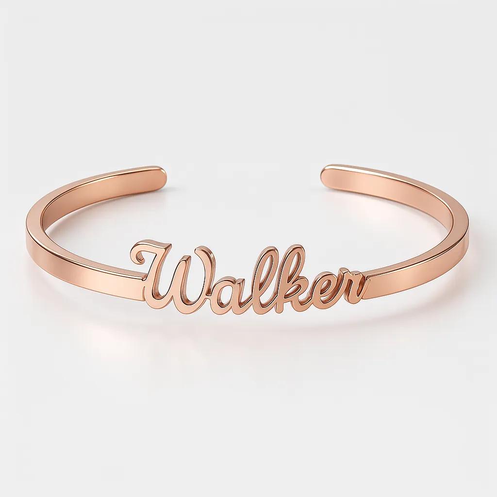 Rose gold bracelet with 'Walker' engraving on a light gray background
