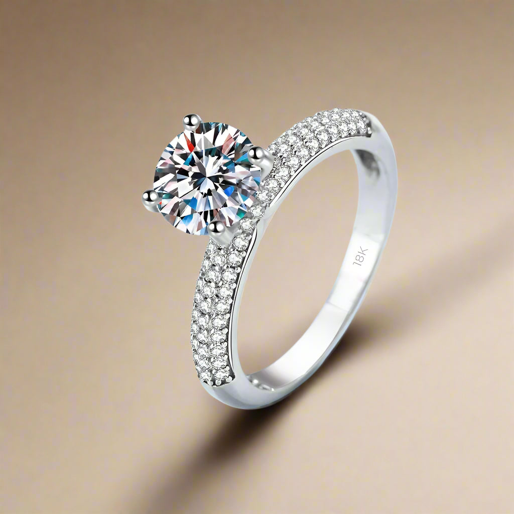  Elegant ring with moissanite centerpiece and pavé stones.