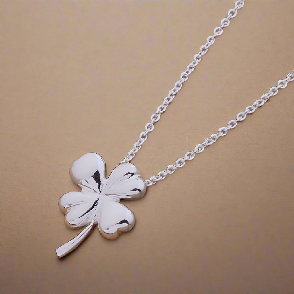 Elegant four-leaf clover necklace with a polished finish.