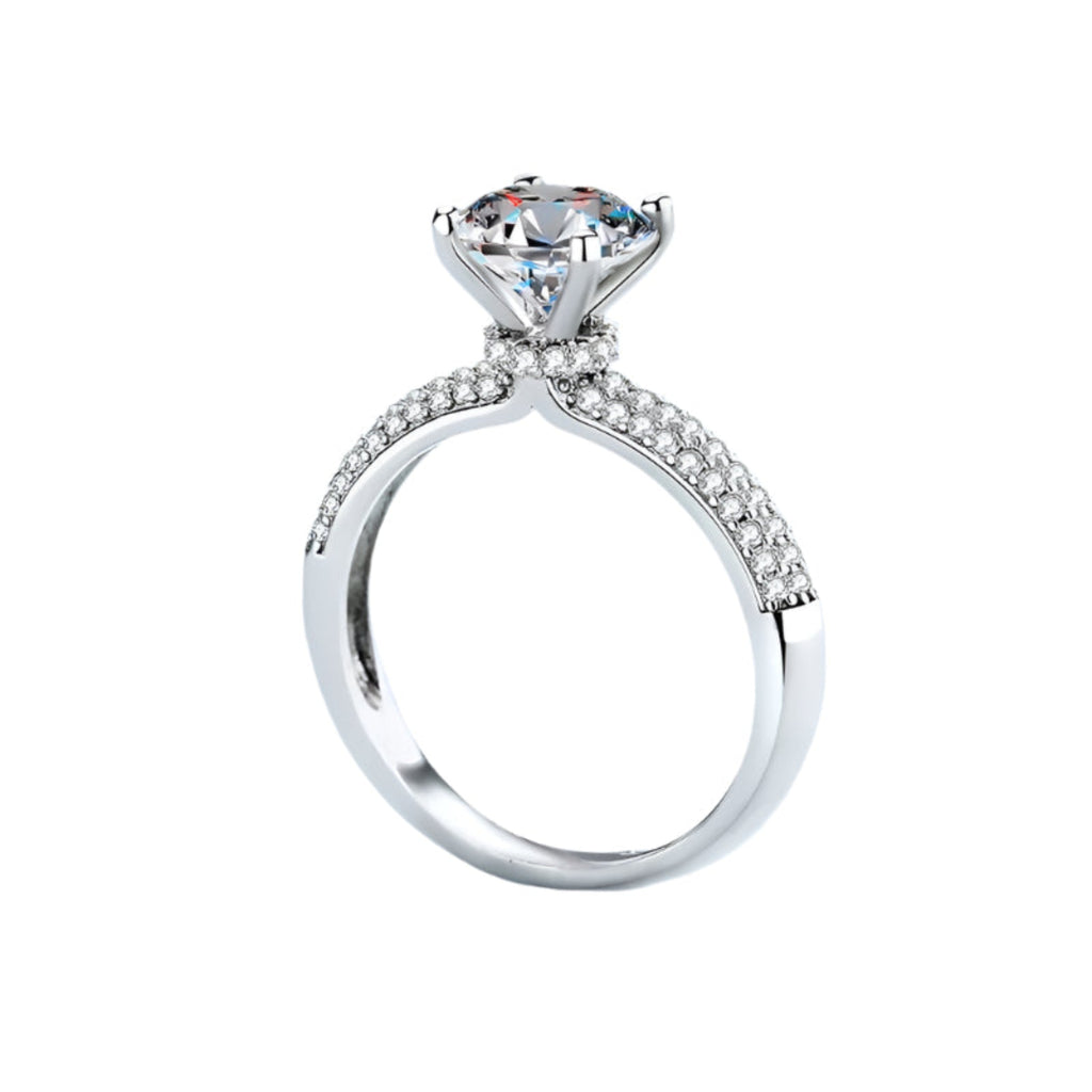Side view of a moissanite ring on a  background