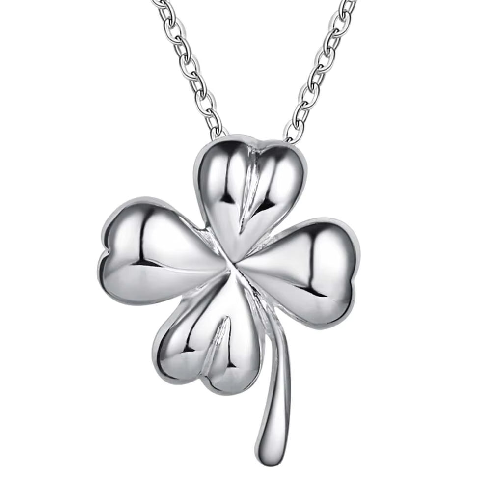 Close-up of a minimalist clover design pendant.