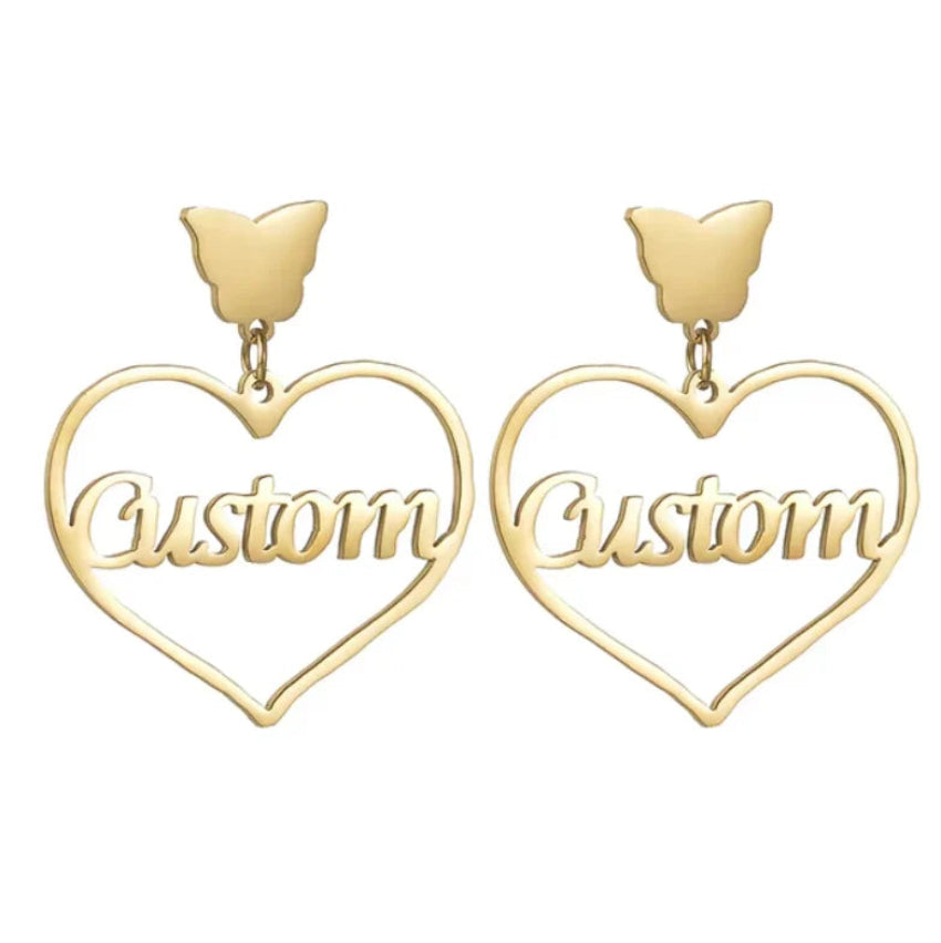 Gold heart-shaped earrings with 'Custom' text on a white background