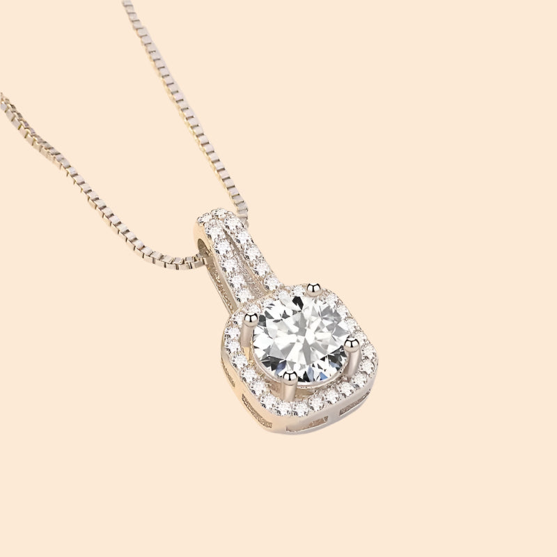 Diamond pendant on a chain with a soft background