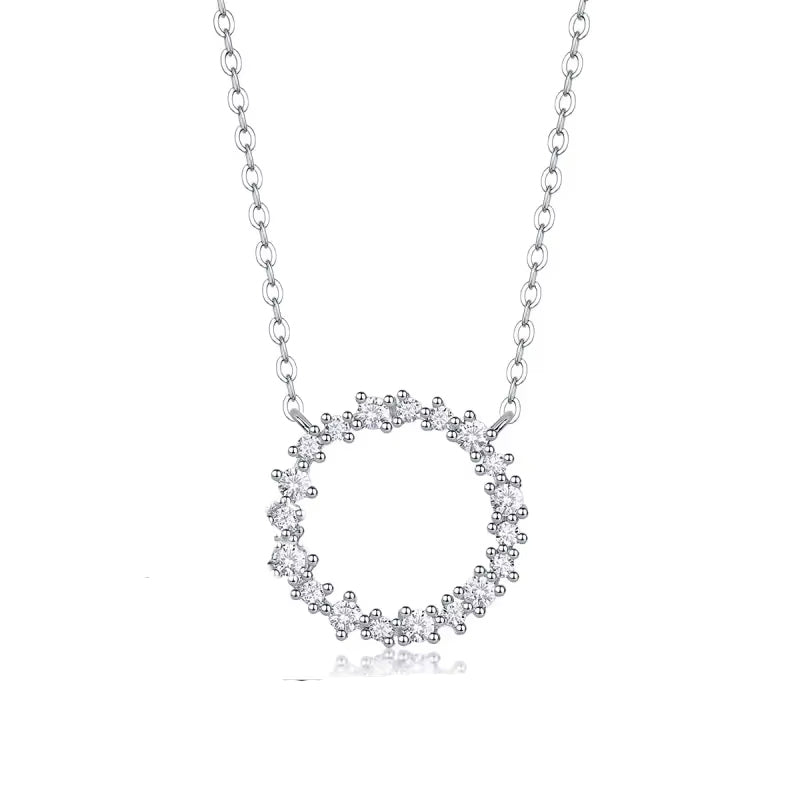 Silver necklace with a circular pendant on a white background