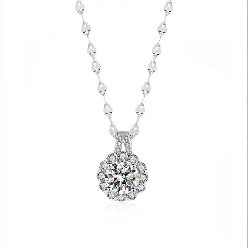 Silver necklace with a sparkling pendant on a white background