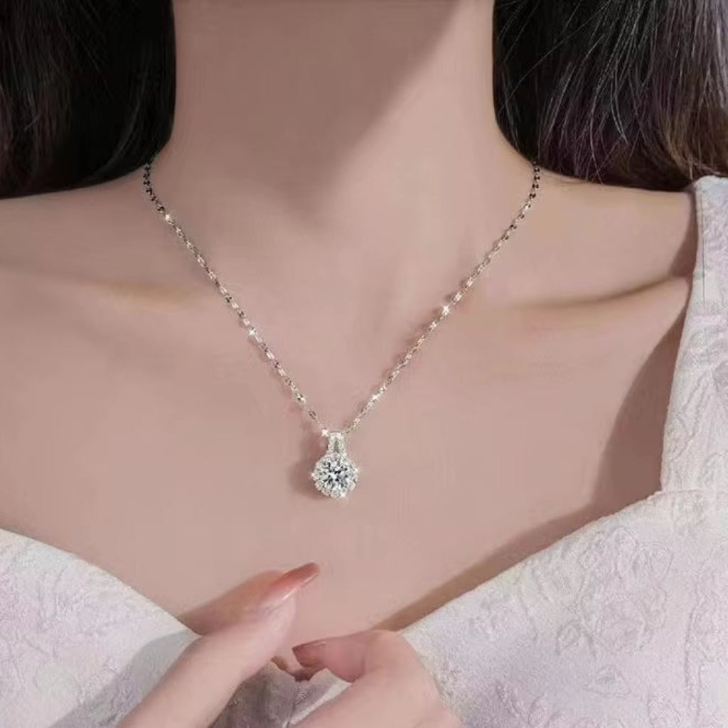 Necklace with a heart-shaped pendant being worn on a mannequin