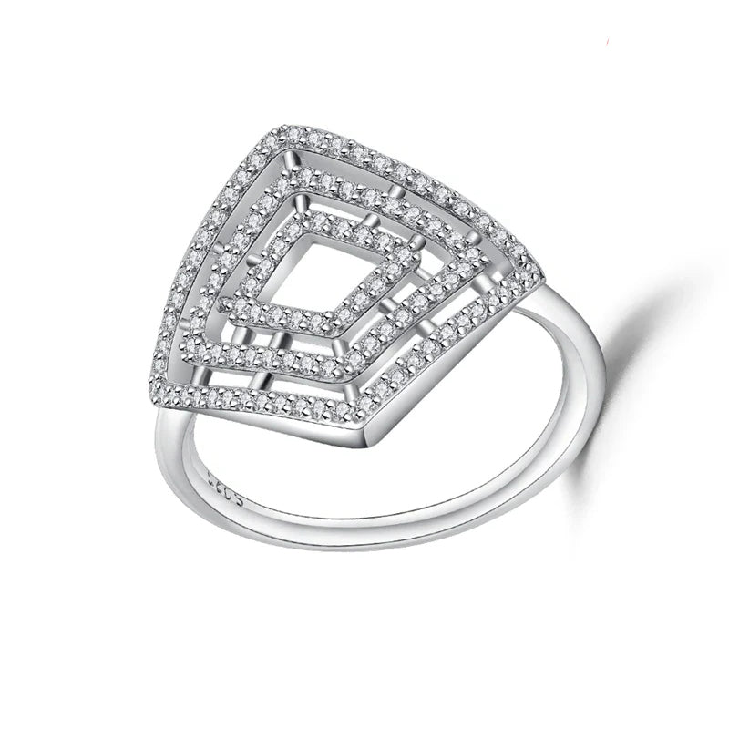 Silver ring with geometric design on a white background