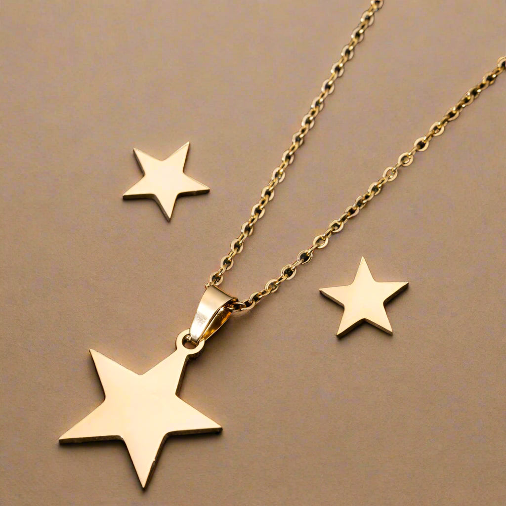 Gold star pendant necklace with matching earrings 