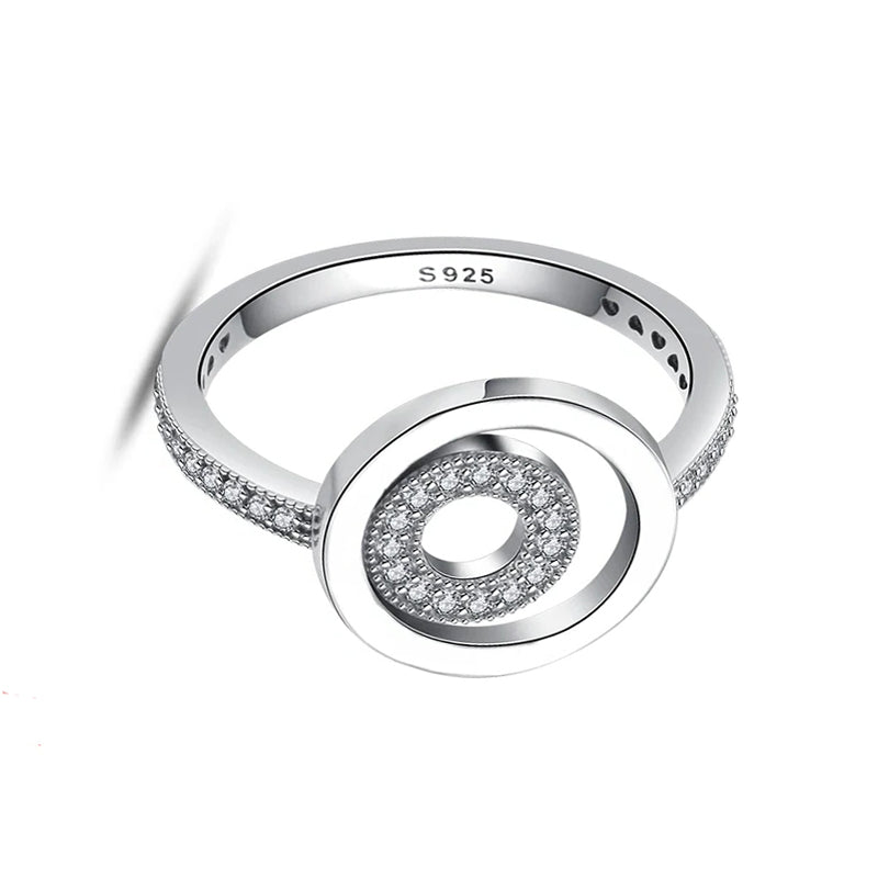 Silver ring with circular design and 'S925' marking on a white background