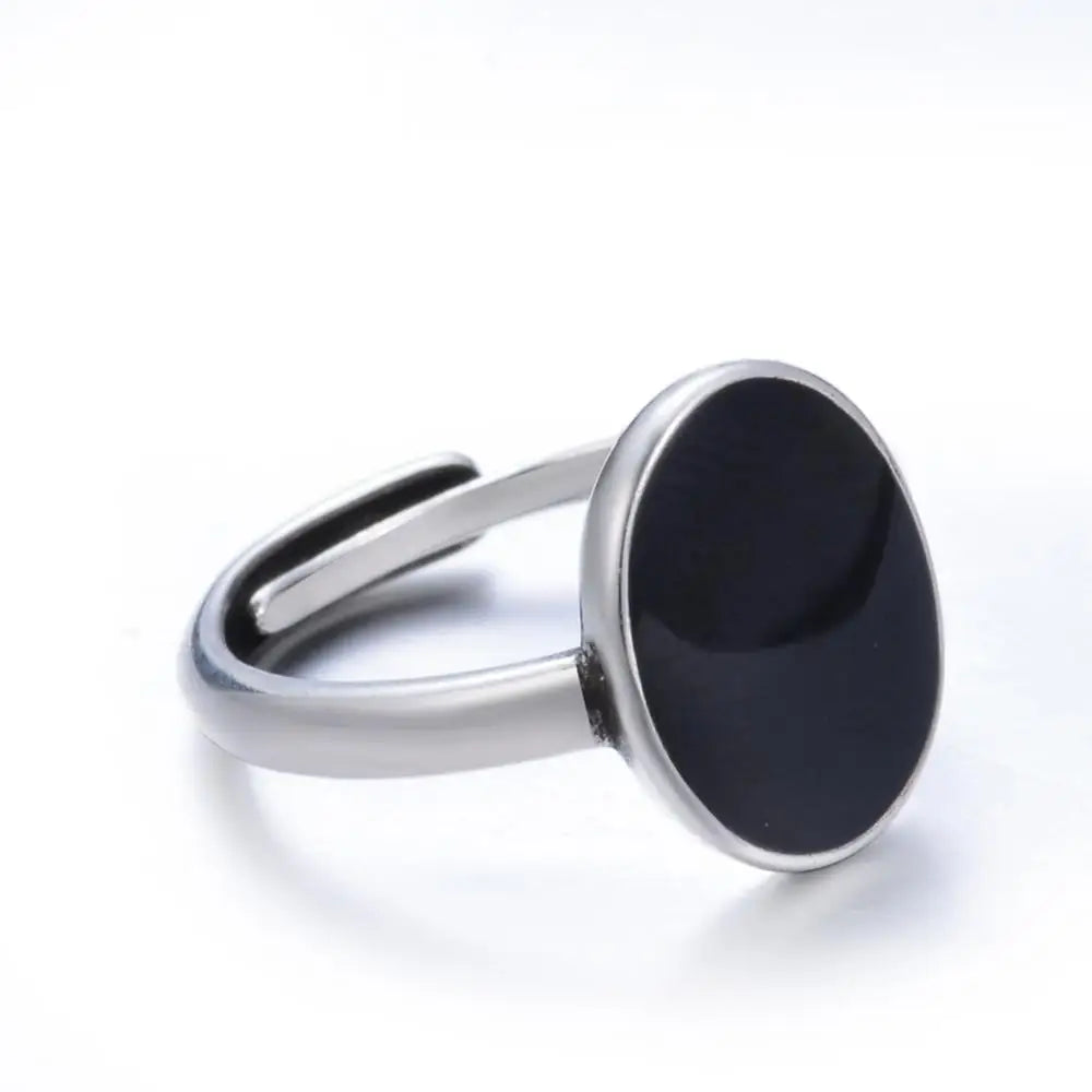 Close-up of modern oval resin ring against white background