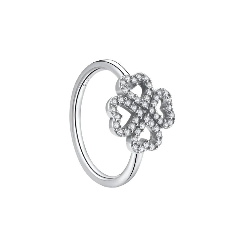 Silver ring with floral design and '925 Sterling' stamp on a white background