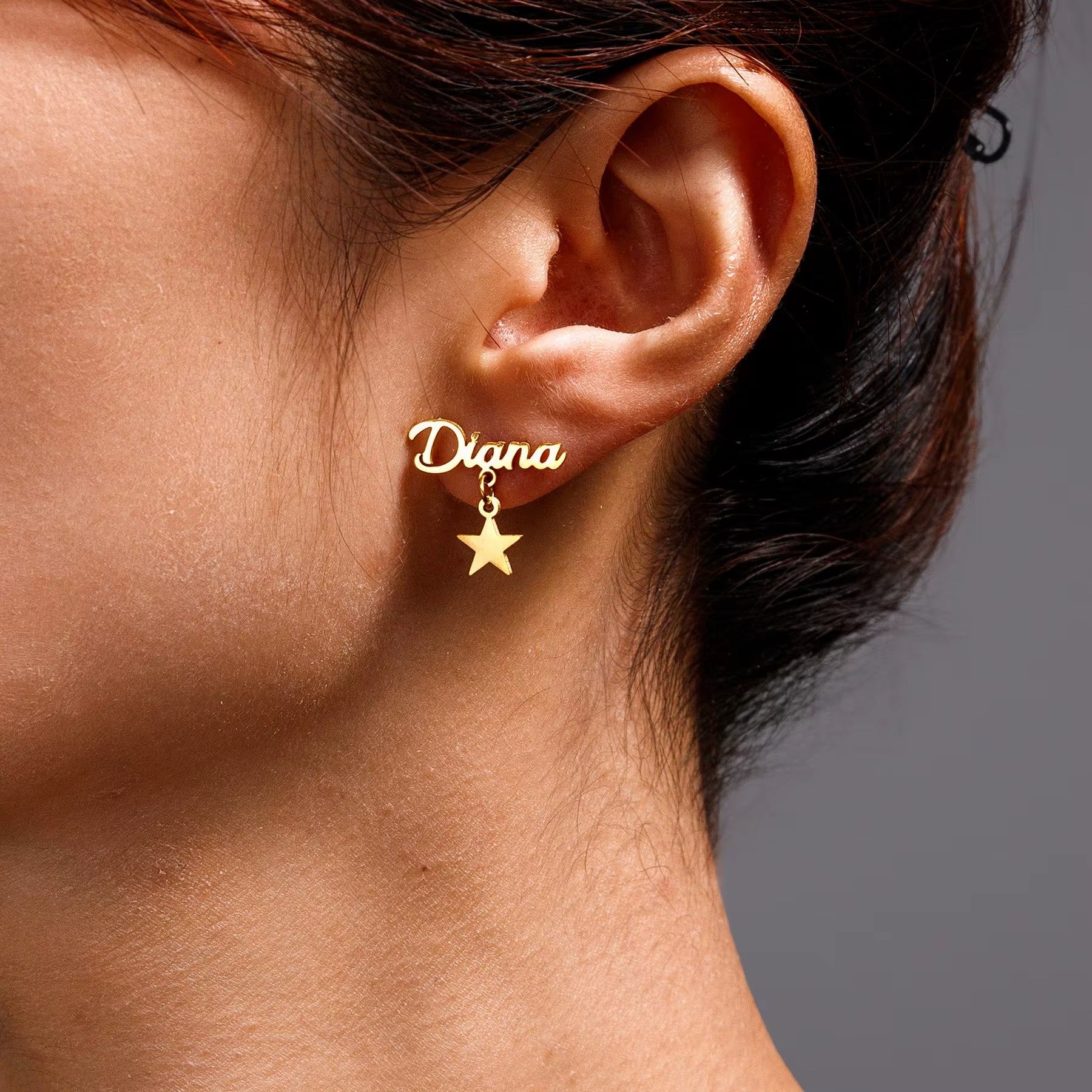 Gold stainless steel custom name earrings with dangling star charm, name “Diana”