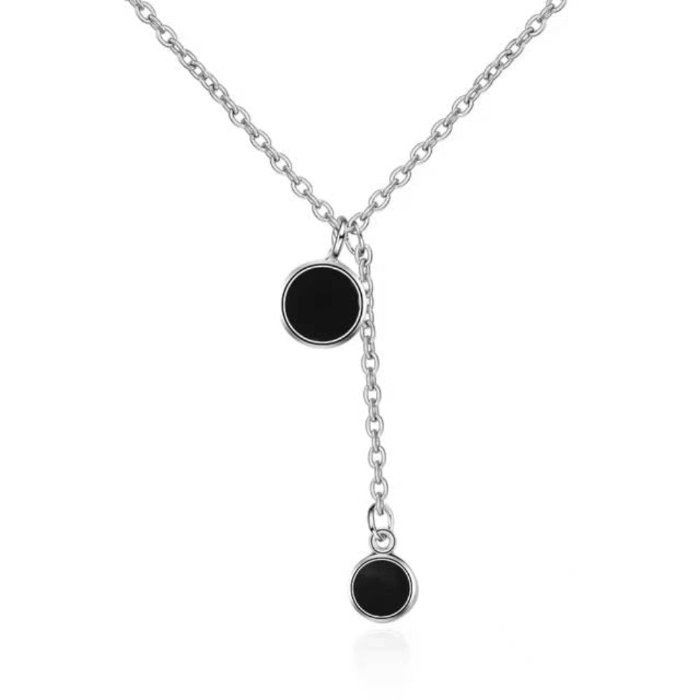 Minimalist black enamel circle pendant necklace in gold finish – flat lay