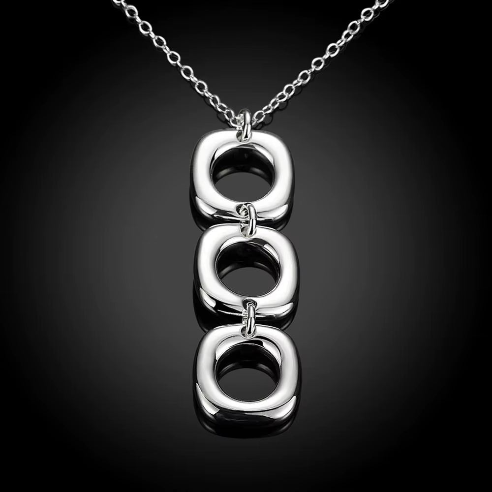 Close-up of polished square links chain on blue background.