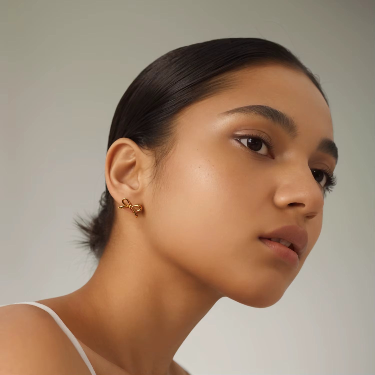 Golden Grace: Bow-Tie Stud Earrings