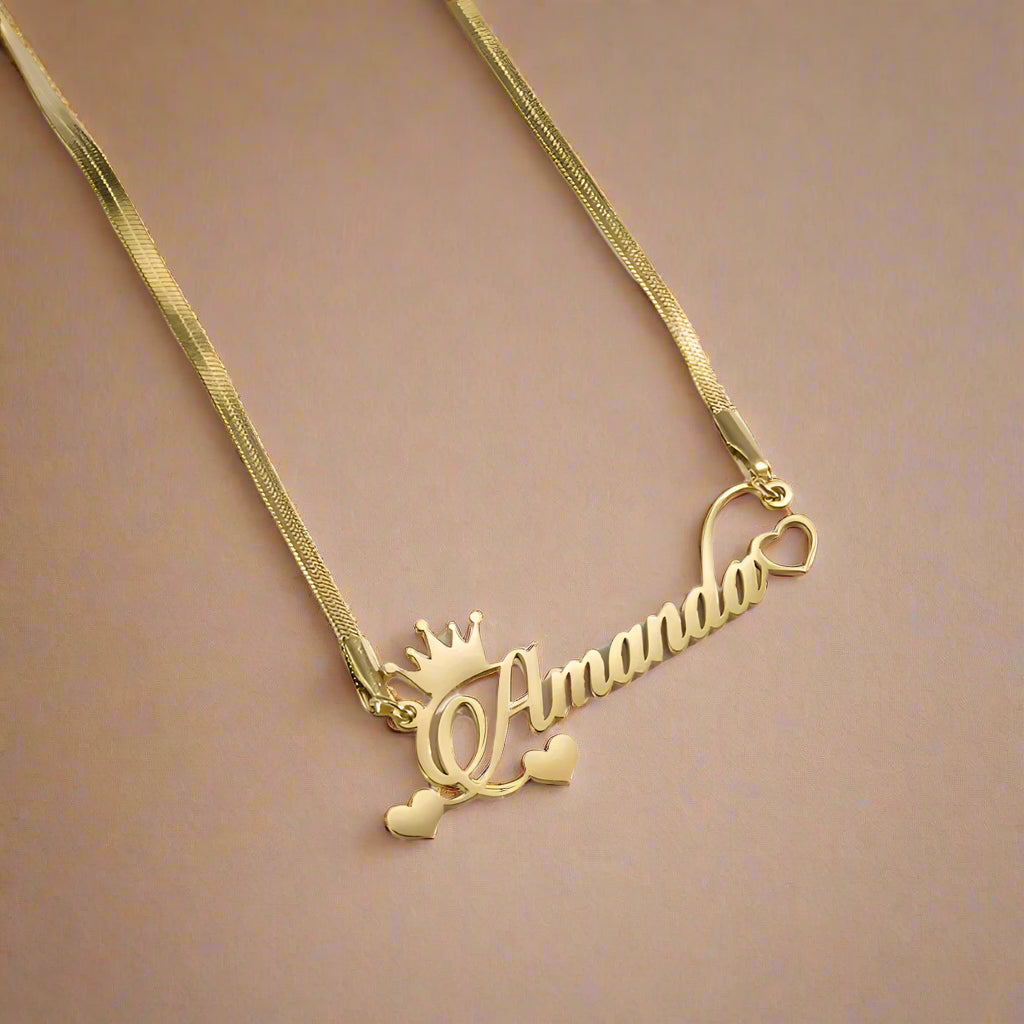 Gold-plated personalized name necklace with crown and heart design, 