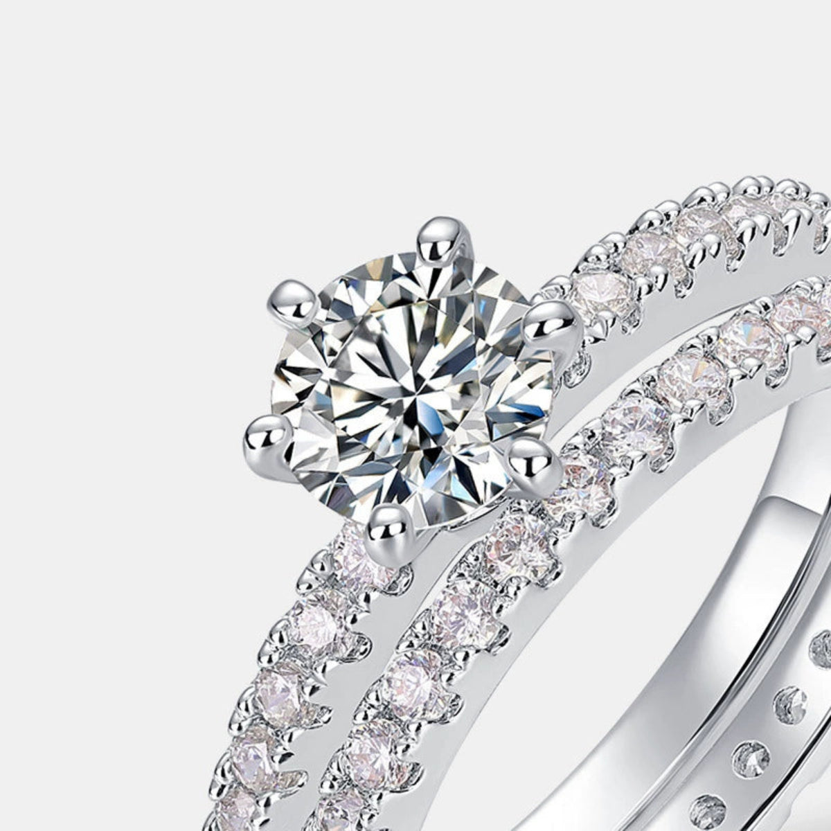  Close-up of a sterling silver ring set with glittering stones.