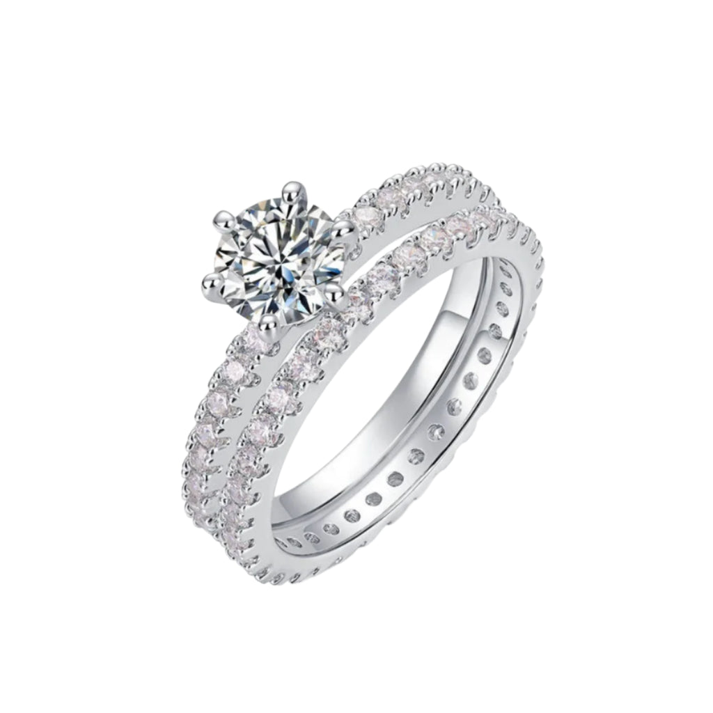 Close-up of a sterling silver ring set with glittering stones.