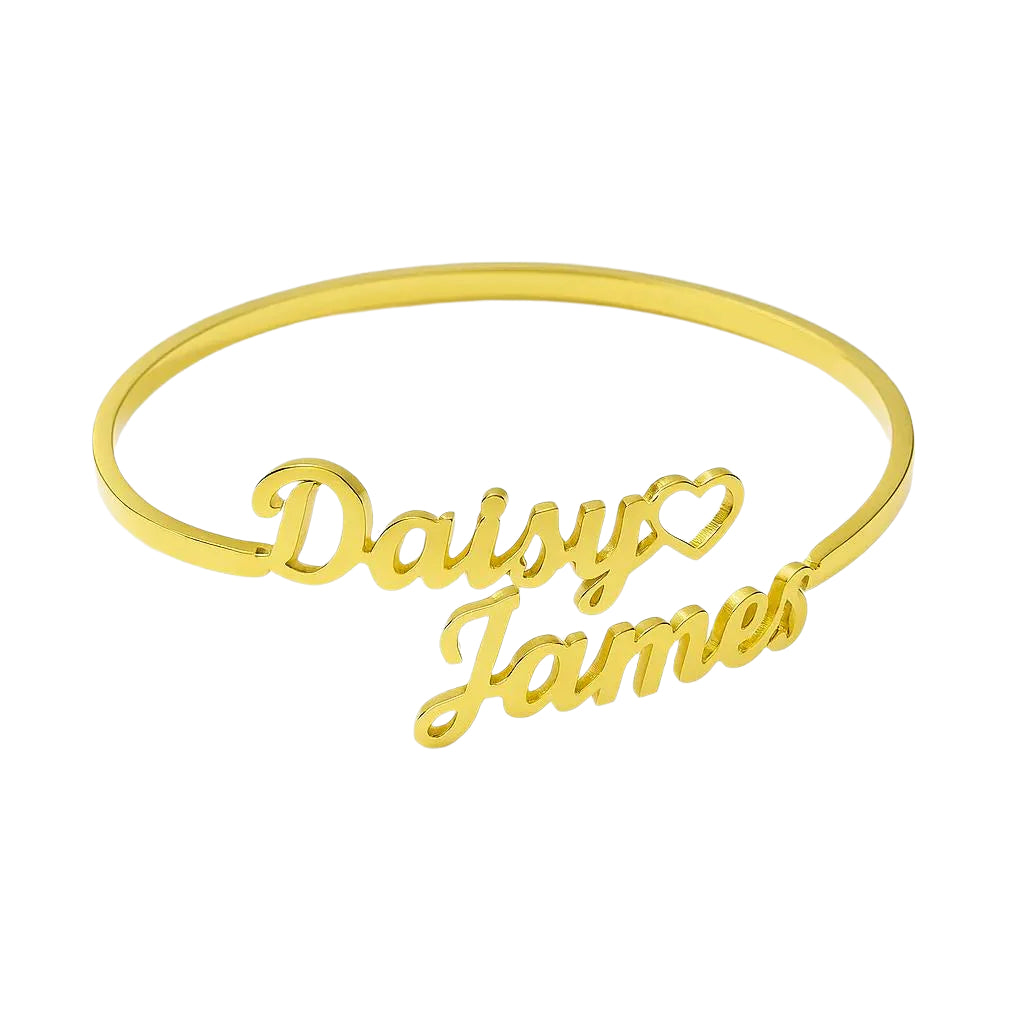 Gold bangle with 'Daisy' and 'James' engraved on a white background