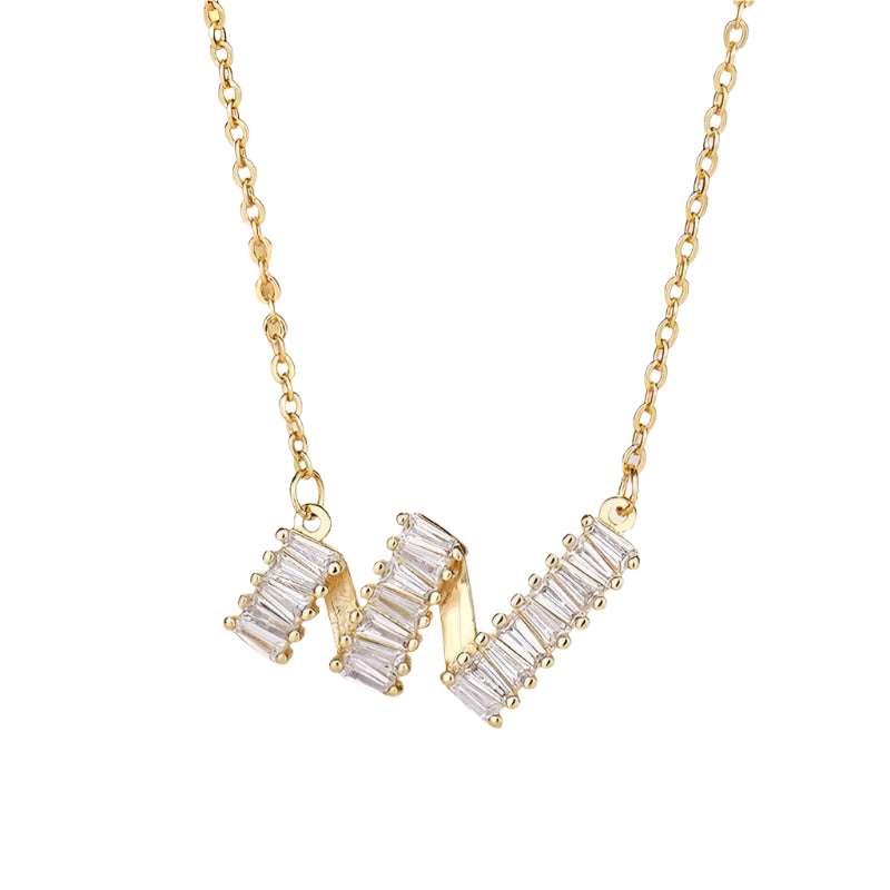 Gold necklace with clear gemstones on a soft background