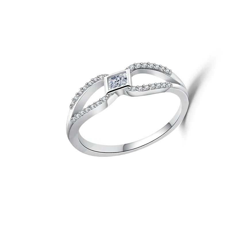 Silver ring with a diamond on a white background