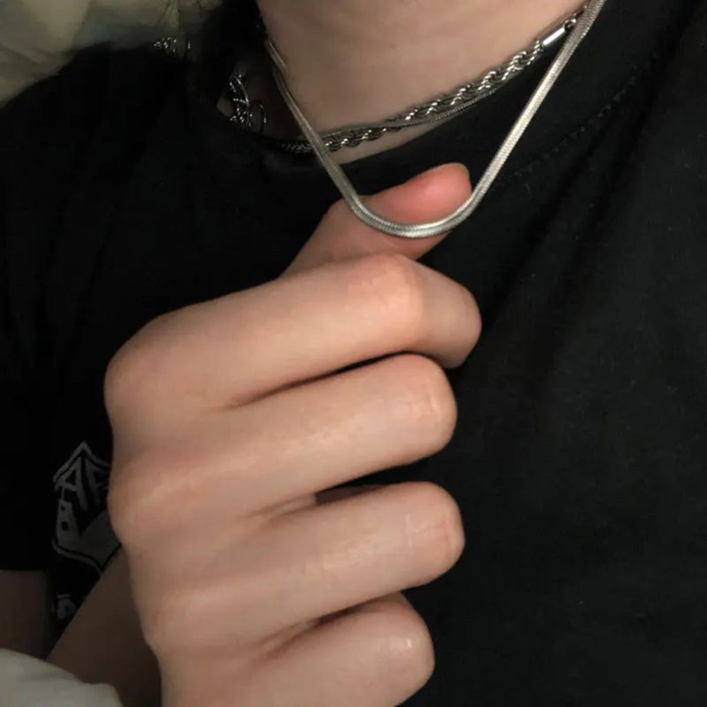 Geometric sterling silver chain styled with black outfit