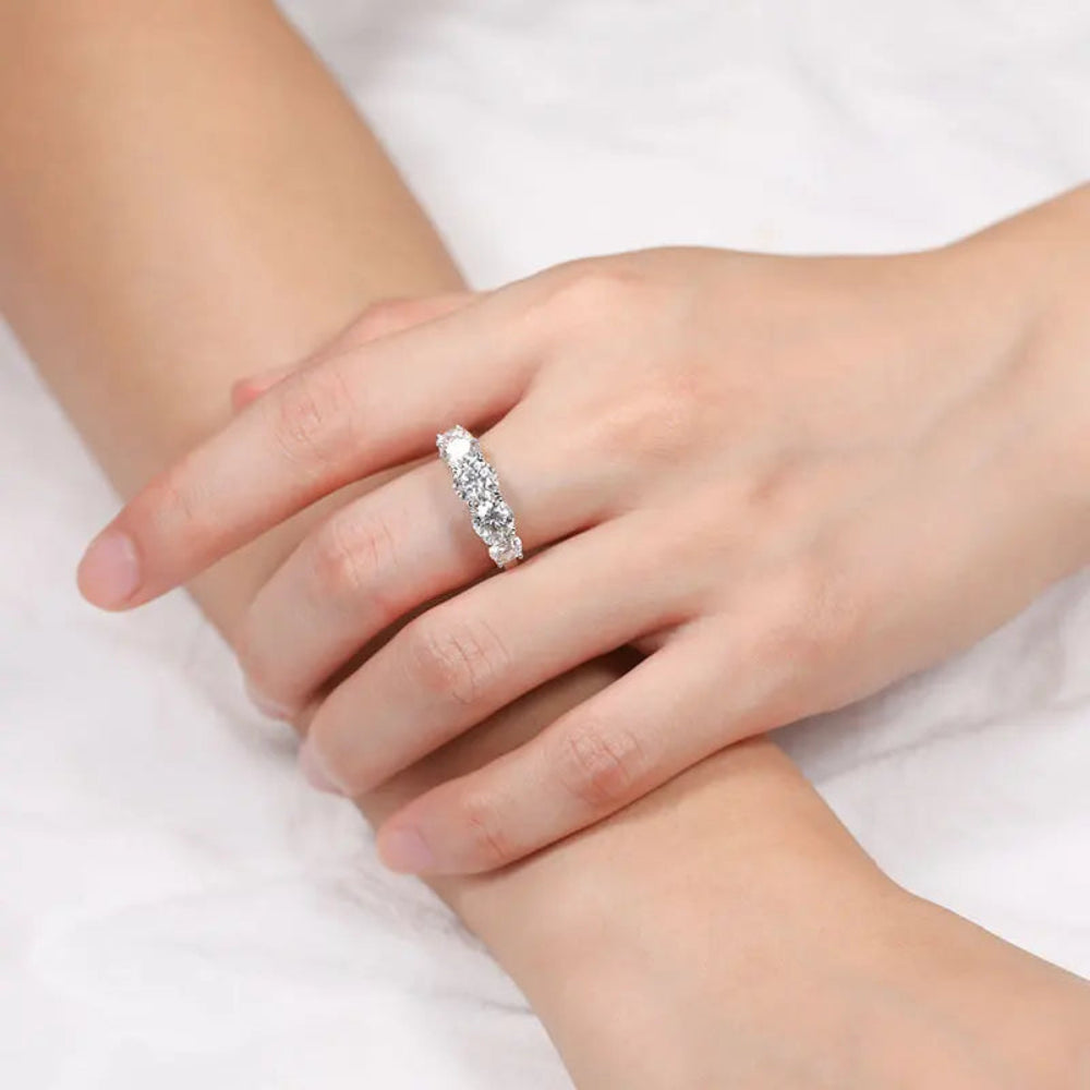 Sterling silver ring with five trillion-cut stones.  