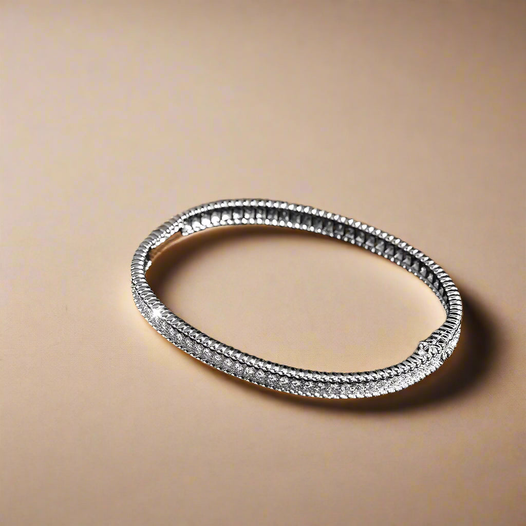 Eternal Glow Bangle Bracelet displayed in a luxury gift box.