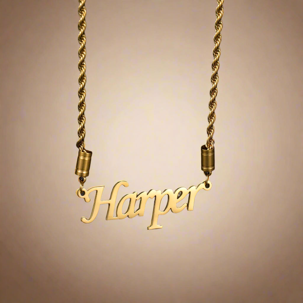 Gold twisted chain necklace with "Harper" in cursive letters
