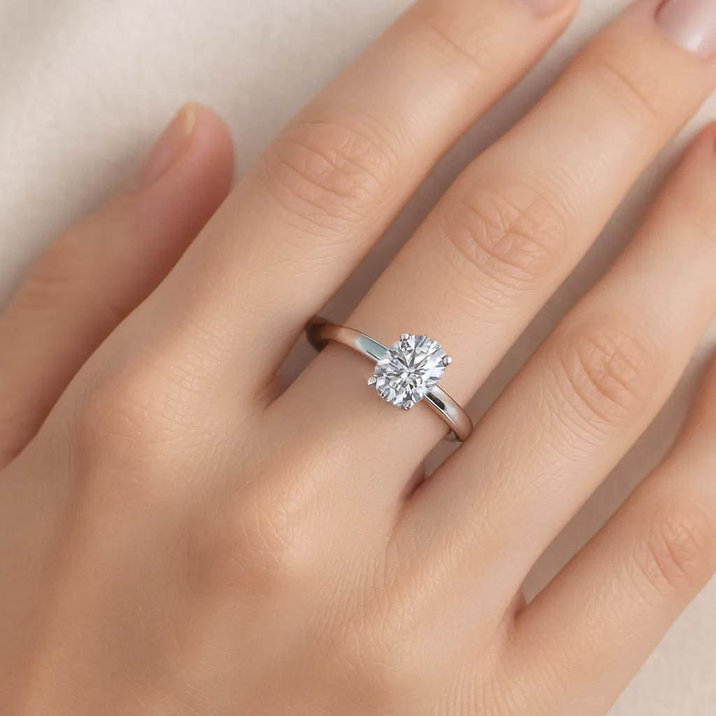 Elegant solitaire ring with sparkling round-cut stone.