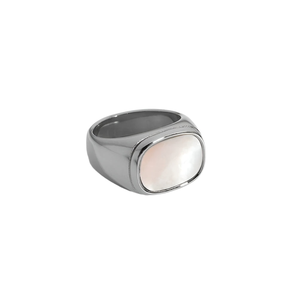 Close-up of minimalist silver ring with pearl detail