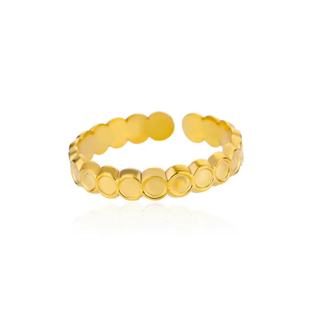 Gold circular-designed ring on white background.