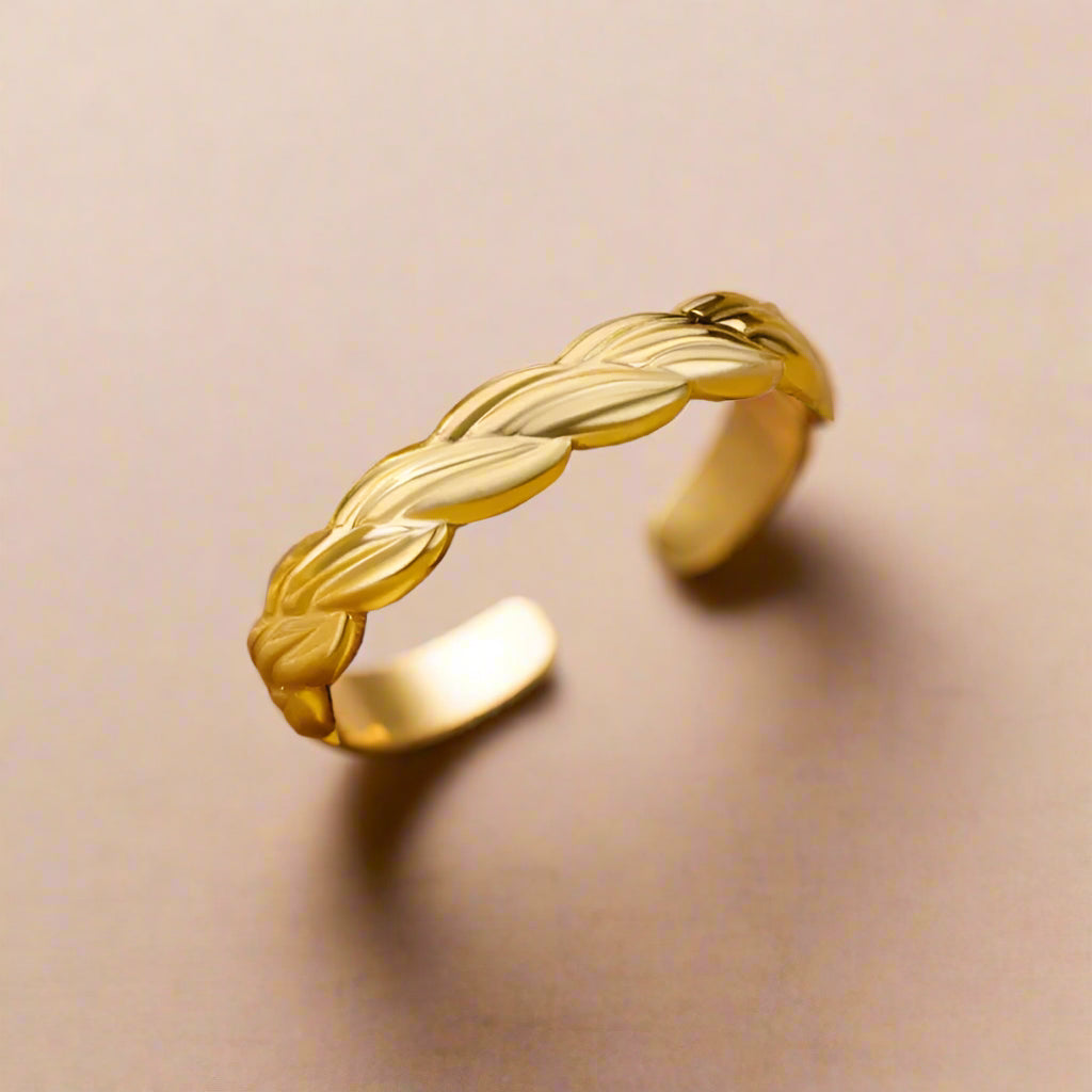 Close-up of adjustable woven gold cuff.