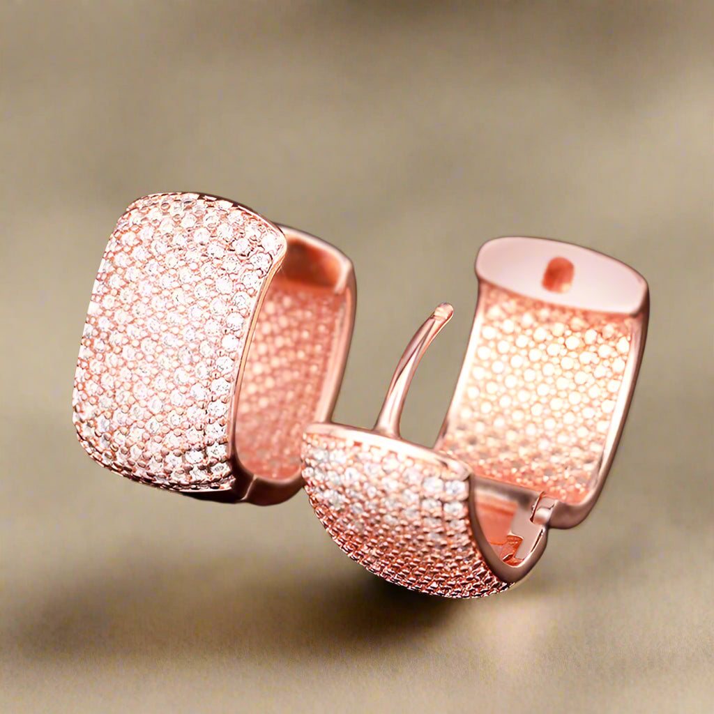 Close-up of silver and gold cubic zirconia earrings